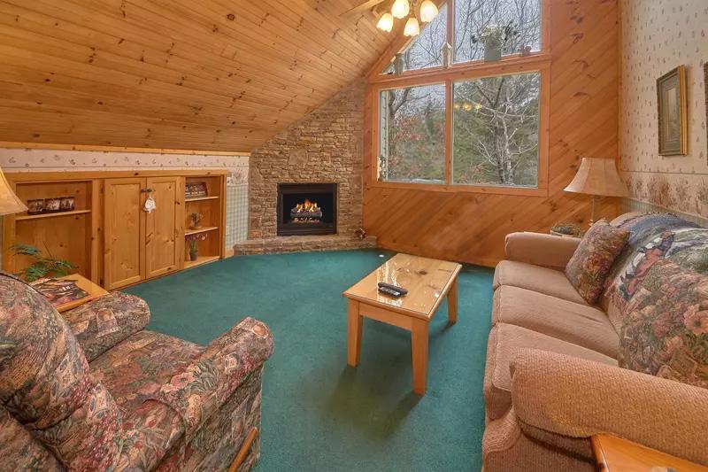 Cabin's upstairs seating with fireplace.